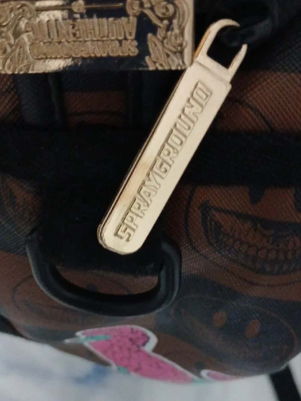 Sprayground Brown Checkerboard Backpack with Multicolor Sticker Graphics